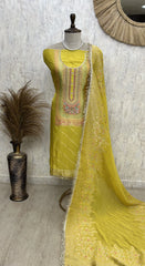 "Buy Unstitched Suit Set Online – Mustard Yellow Banarasi Silk Suit with Embroidered Neckline and Zari Woven Dupatta"