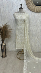 “Off-white georgette unstitched suit set with intricate white embroidery and pearl work, paired with sheer embroidered dupatta on mannequin.”