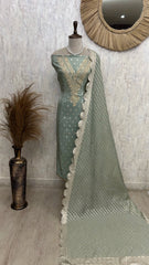Unstitched Tissue Suit Set Featuring Zari Work On Neckline