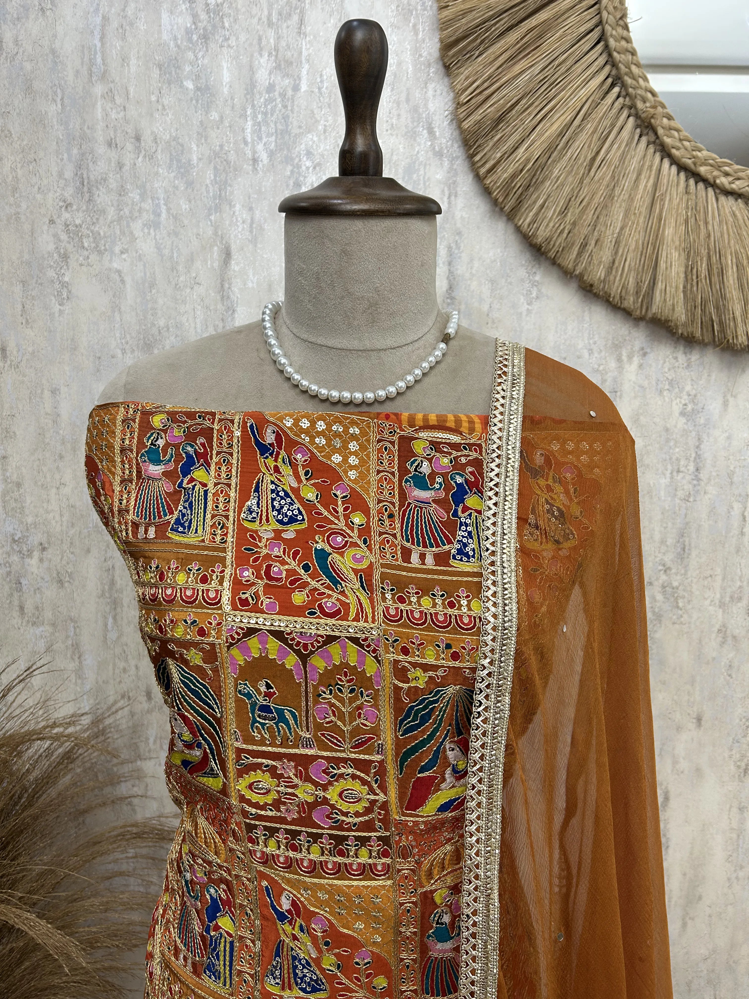 Semi Crepe Unstitched Suit with traditional motifs